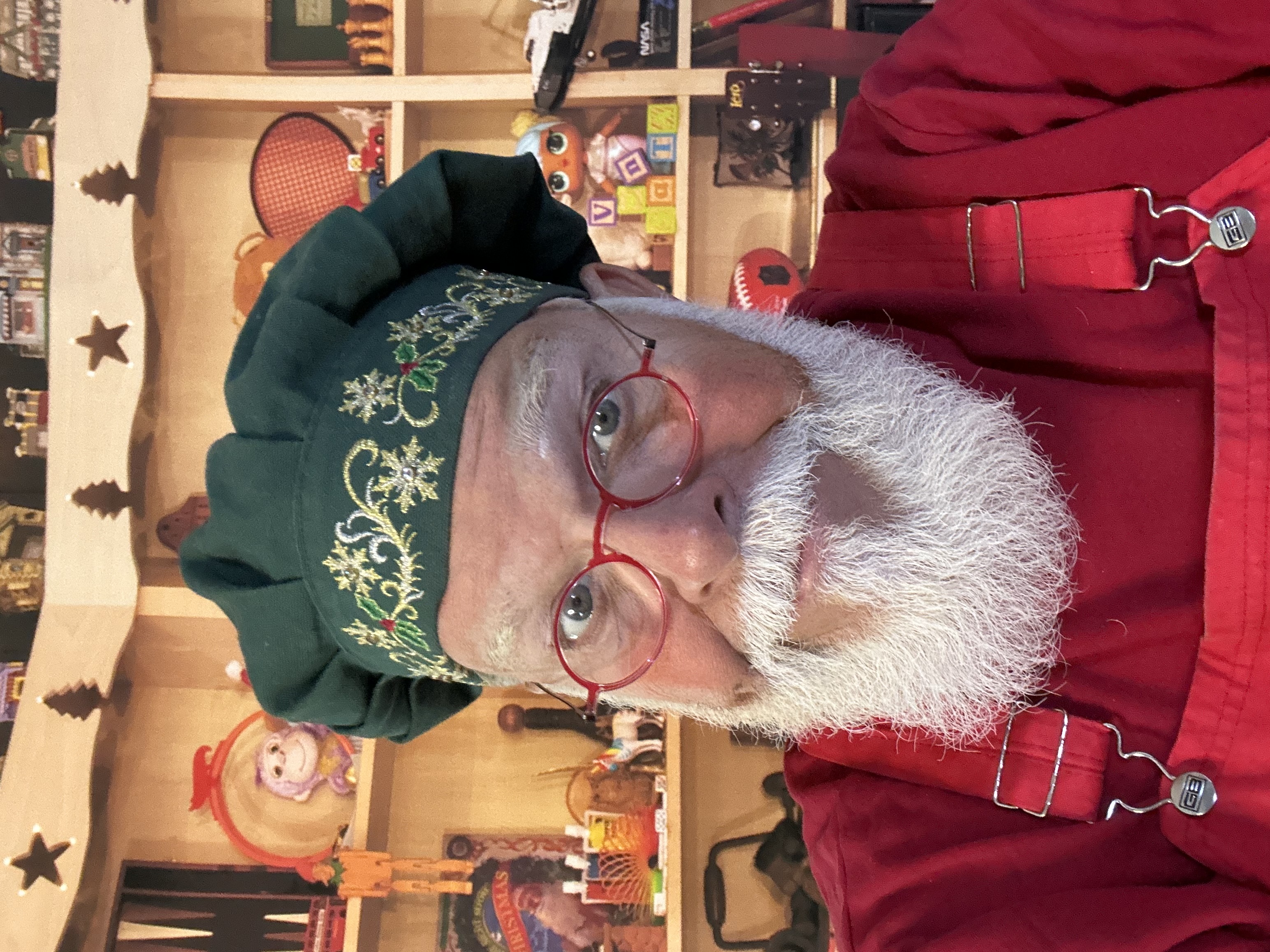 CJ Kringle in a green holiday hat
